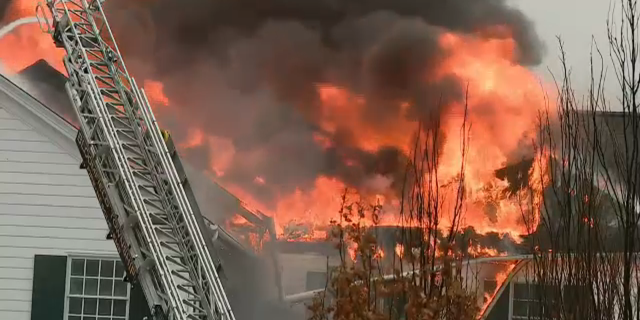 A fire tore through the Oakland Hills Country Club in Michigan Thursday morning, collapsing the storied structure's roof.