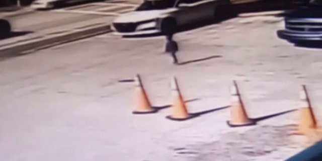 A still from surveillance video released by the state appears to show Mayson, 2, walking toward traffic.