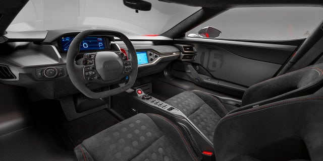 Gold and red interior accents match the car's livery.