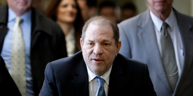  In this Feb. 24, 2020, file photo, Harvey Weinstein arrives at a Manhattan courthouse as jury deliberations continue in his rape trial in New York. A limousine driver testified Wednesday, Feb. 23, 2022, that in 2013 he took Weinstein to a Beverly Hills hotel where prosecutors allege Weinstein raped an actor.