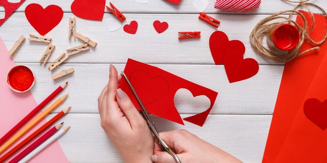 TikTok user Lauren Campanella’s scratch-off Valentine’s Day card idea helps DIY crafters make interactive holiday stationery with construction paper, stickers, pencils, markers, paint, liquid dish soap and white crayon.