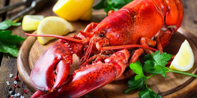 Red lobster on wooden cutting board