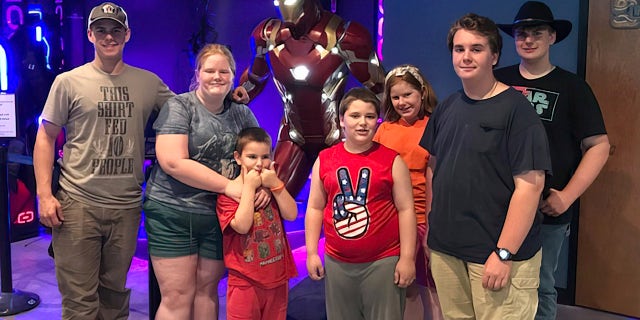Lucas Johnson (far left) along with members of his family — he's the oldest of seven, and the family has another child on the way. His mom described him as "the leader of our pack."