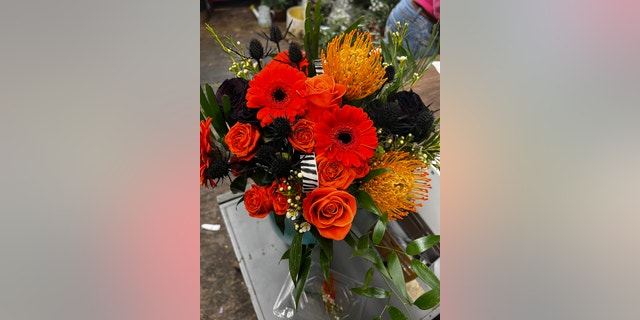 Rachel Hyden will be carrying this Bengals-colored bouquet on her big day.