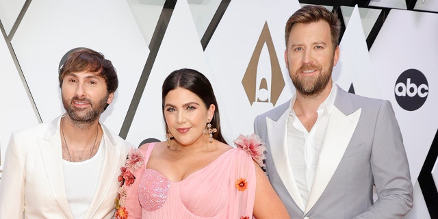 (L-R) Dave Haywood, Hillary Scott and Charles Kelley of Lady A attend the 55th annual Country Music Association awards.