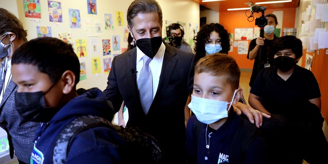 Superintendent Alberto M. Carvalho, Los Angeles Unifed School District, shown with students as he tours Maywood Center For Enriched Studies (MaCES) Magnet school on Wednesday, Feb. 16, 2022 in Maywood, CA. (Gary Coronado / Los Angeles Times via Getty Images)