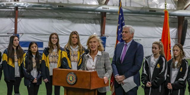 Nassau County Comptroller Elaine Phillips joined the cheerleaders at the Mitchel Field Athletic Center on Tuesday.