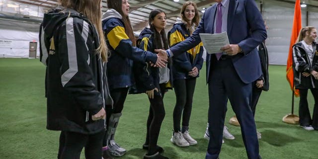 Nassau County Executive Bruce Blakeman meets with cheerleaders.