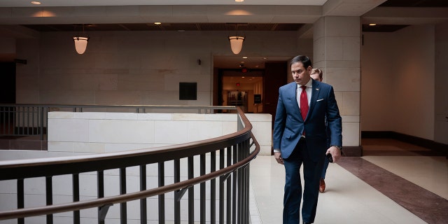 Sen. Marco Rubio walks to a briefing with the Senate Intelligence Committee at the Capitol in Washington on Feb. 16, 2022.
