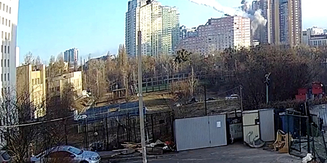 Surveillance footage shows a missile hitting a residential building in Kyiv, Ukraine, February 26, 2022, in this still image taken from a handout video. 