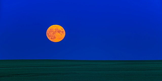 The rising of the almost exactly Full Moon on July 16, 2019, the 50th Anniversary of the launch of Apollo 11. (Photo by: Alan Dyer/VWPics/Universal Images Group via Getty Images)