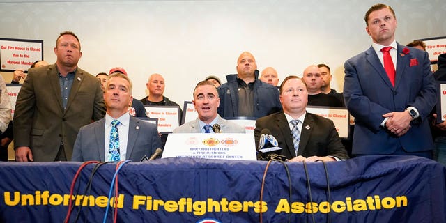 FDNY Fire Officers Association President Jim McCarthy, left, is joined by International Association of Fire Fighters President Ed Kelly, center, and FDNY-Firefighters Association President Andrew Ansbro during a news conference to protest New York City's COVID-19 vaccine mandate, Tuesday, Nov. 2, 2021, in New York. 