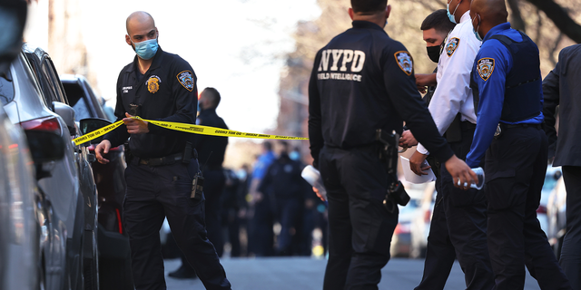 NYPD officers respond to the scene of a shooting that left multiple people injured in the Flatbush neighborhood of the Brooklyn borough on April 06, 2021 in New York City. 