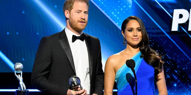 Prince Harry (L) and Meghan Markle, Duke and Duchess of Sussex, accept the President's Award at the 53rd NAACP Image Awards Show at The Switch on Saturday, February 26, 2022 in Burbank, California.
