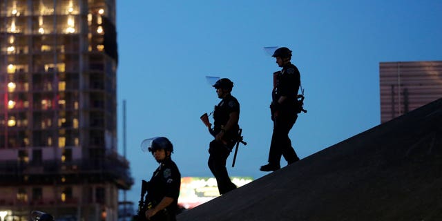 Austin police keep watch as demonstrators gather on June 4, 2020, in downtown Austin, Texas, as they protest the death of George Floyd