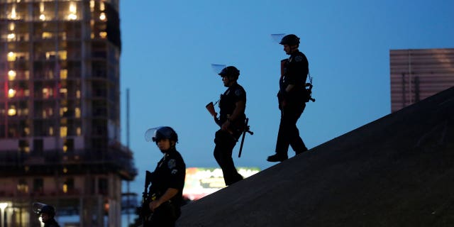 Austin police keep watch as demonstrators gather on June 4, 2020, in downtown Austin, Texas, as they protest the death of George Floyd