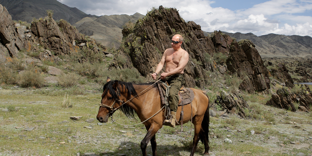 Russian President Vladimir Putin rides a horse during his vacation outside the town of Kyzyl in Southern Siberia on August 3, 2009