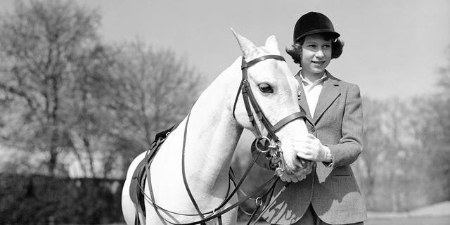 Princess Elizabeth the eldest daughter of King George VI and Queen Elizabeth, poses for a photo on her 13th birthday, in Windsor Great Park, in England, April 21, 1939. 