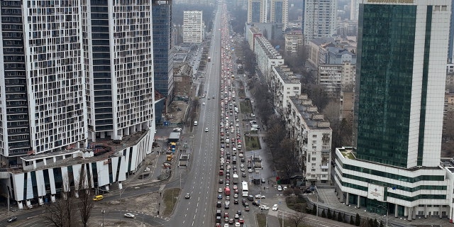 Traffic jams are seen as people leave the city of Kyiv, Ukraine, Thursday, Feb. 24, 2022. Russian President Vladimir Putin on Thursday announced a military operation in Ukraine and warned other countries that any attempt to interfere with the Russian action would lead to "consequences you have never seen."