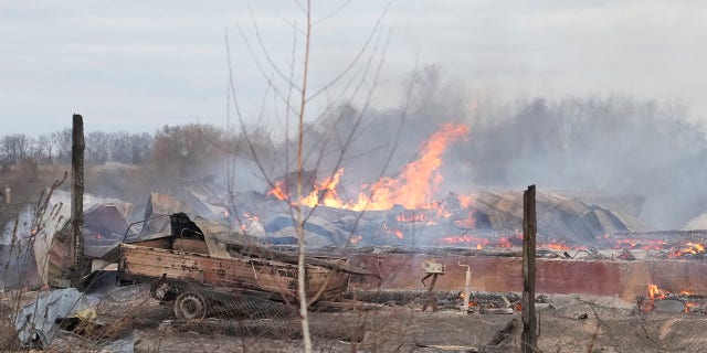 Flame and smoke rise from the debris of a privet house in the aftermath of Russian shelling outside Kyiv, Ukraine, Thursday, Feb. 24, 2022.