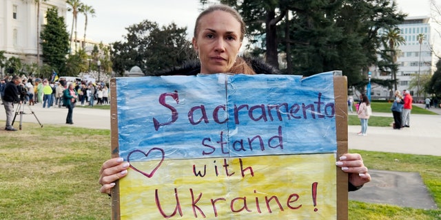 Olga, a Ukrainian citizen who lives in Sacramento, Calif., shows her support for her homeland during a rally Feb. 24, 2022.