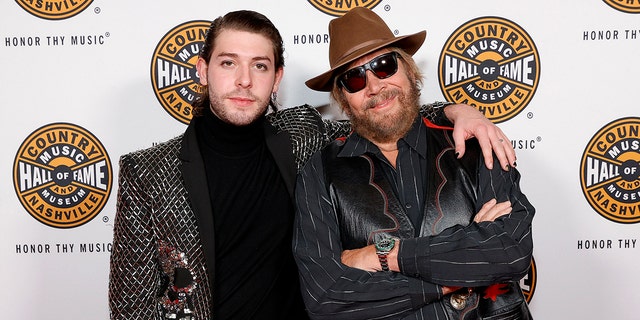 Sam Williams and 2020 inductee Hank Williams Jr. attend the 2021 Medallion Ceremony, celebrating the Induction of the Class of 2020 at Country Music Hall of Fame and Museum on Nov. 21, 2021, in Nashville, Tennessee.