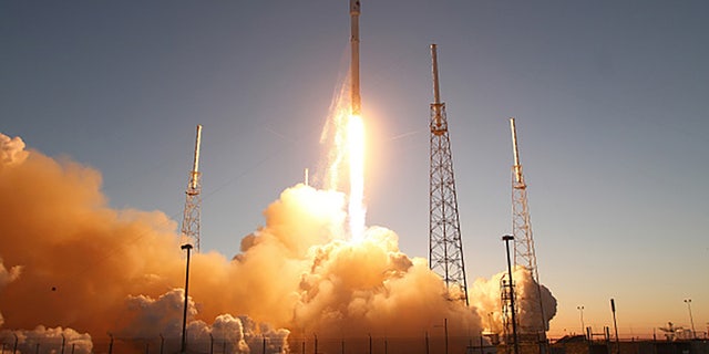 A SpaceX Falcon9 rocket blasts off the launch pad on Wednesday, Feb. 11, 2015, carrying the NOAA's Deep Space Climate Observatory spacecraft that will orbit between Earth and the sun, providing advanced warning of extreme emissions from the sun which can effect power grids and satellites close to earth. (Red Huber/Orlando Sentinel/Tribune News Service via Getty Images)