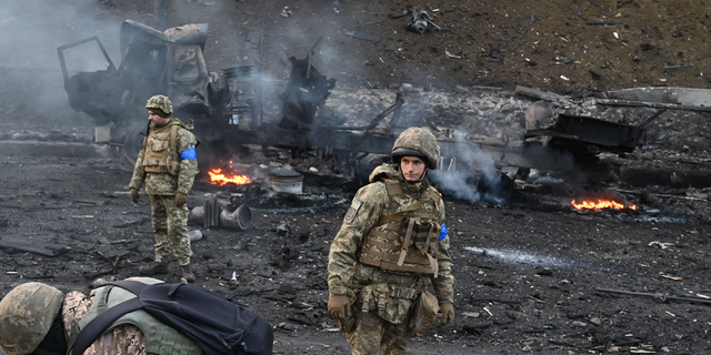 The Ukrainian military is looking for and collecting unexploded ordnance after fighting with a Russian raider group in the Ukrainian capital Kiev on the morning of February 26, 2022, Ukrainian military said at the scene.