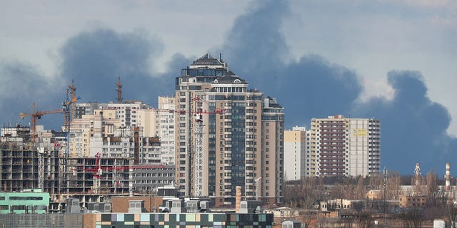 Smoke rising after shelling on the outskirts of the city is pictured from central Kyiv, Ukraine February 27, 2022. REUTERS/Irakli Gedenidze