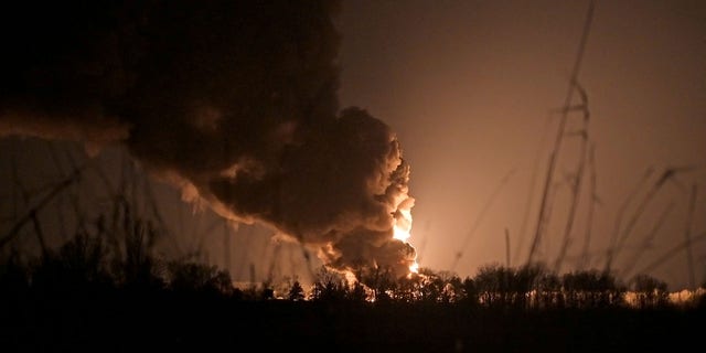 A view shows a burning oil depot reportedly hit by shelling near the military airbase Vasylkiv in the Kyiv region, Ukraine Feb. 27, 2022. 