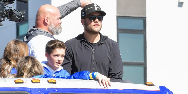 From the left, Andrew Whitworth and Matthew Stafford are seen at the Los Angeles Rams Super Bowl LVI Victory Parade and Rally on February 16, 2022 in Los Angeles. (Photo by Rodin Eckenroth/Getty Images)