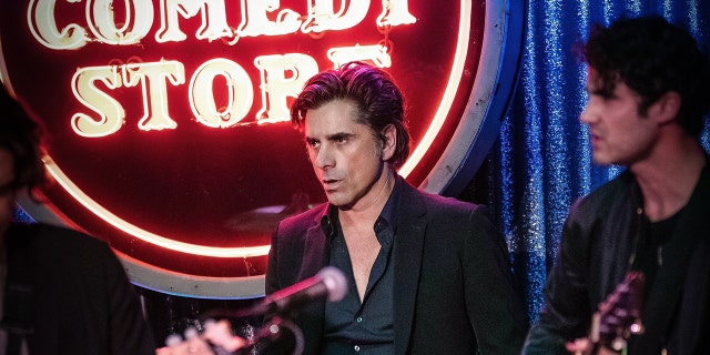 John Stamos on drums and Darren Criss on guitar for the farewell concert at Los Angeles' The Comedy Store in memory of Bob Saget.