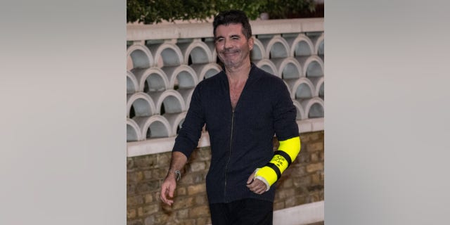 Simon Cowell was spotted for the first time since breaking his arm in an electric bike accident.