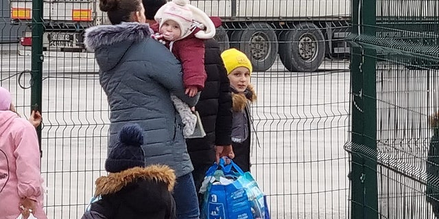 On February 26, 2022, a woman and her husband together with their five children exit Ukraine and cross into Romania through the Porubne-Siret border. "We couldn't wait for the bombs to start. So we escape[d] now. We have nowhere to go, but [we had] to leave," said the mother.