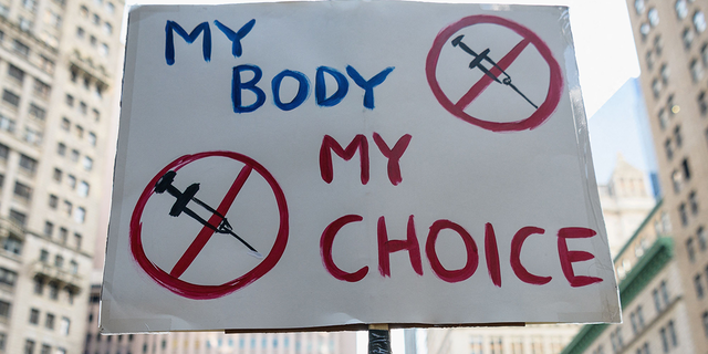 Protesters opposed to COVID-19 vaccine mandates and passports rally at City Hall in New York City on Aug. 25, 2021.