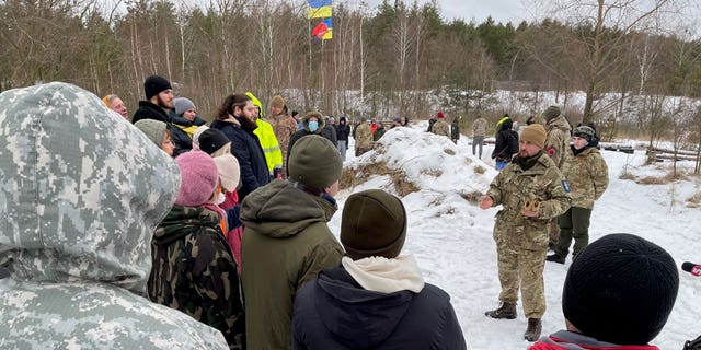 Ukrainian grannies and grandpas giving on-the-street lectures to young Russian soldiers, kids hurling their prized bikes under military truck treads to turn them away, 