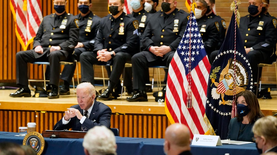 President Biden speaks at an event to discuss gun violence strategies, at police headquarters, Thursday, Feb. 3, 2022, in New York. Gov. Kathy Hochul, D-N.Y. is seated right. 