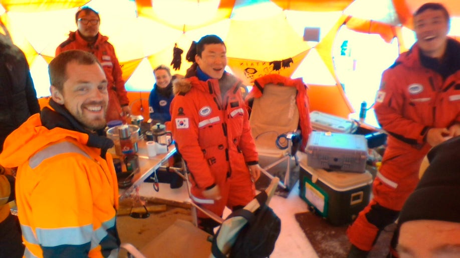 David Holland photo shows members of a research team gathered for dinner on the Dotson Ice Shelf in Antarctica