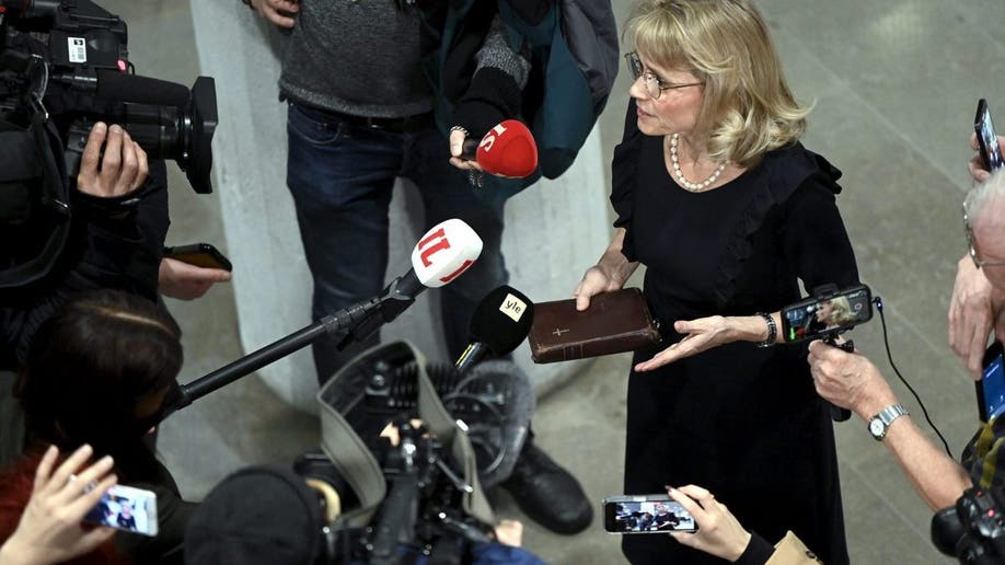 MP of the Finland's Christian Democrats Paivi Rasanen holds a bible as she speaks to media ahead of a court session at the Helsinki District Court in Helsinki, Finland on January 24, 2022. - The trial against former interior minister and Christian Democrats leader Paivi Rasanen over four charges of incitement against a minority group has started on January 24, 2022. - Finland OUT (Photo by Antti Aimo-Koivisto / Lehtikuva / AFP) / Finland OUT (Photo by ANTTI AIMO-KOIVISTO/Lehtikuva/AFP via Getty Images)