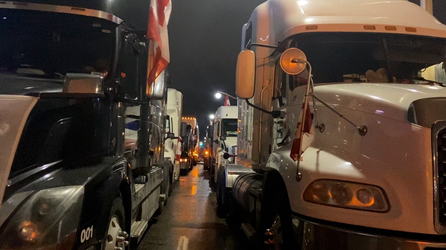 Trucks line the downtown streets of Ottawa on the 14th day of the "Freedom Convoy."