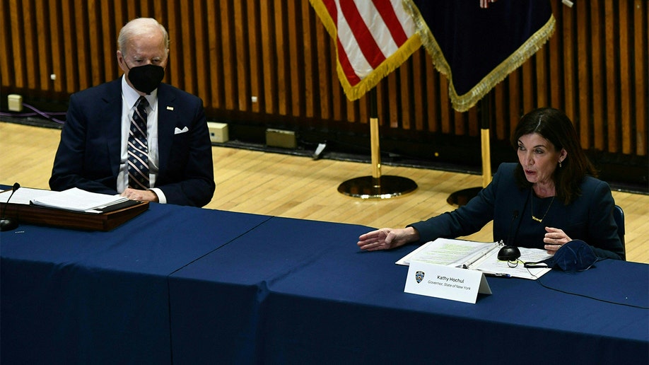 President Biden listens to New York Gov. Kathy Hochul speak during a Gun Violence Strategies Partnership meeting at the New York Police Department Headquarters in New York on Feb. 3, 2022.