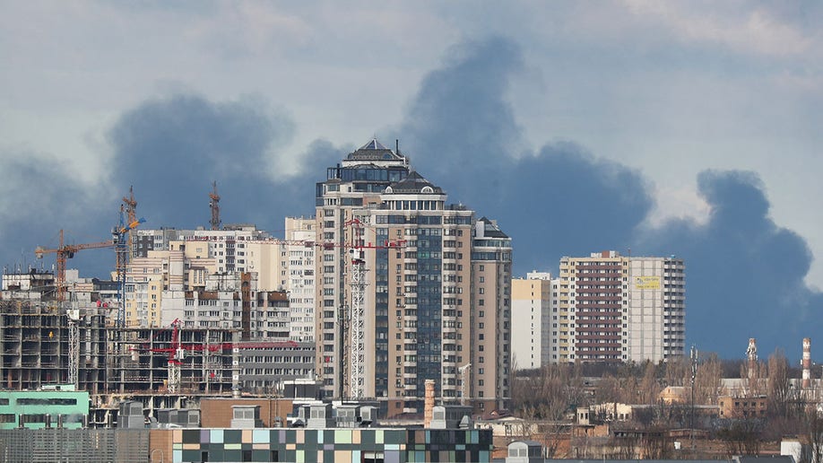 Smoke rising after shelling on the outskirts of the city is pictured from central Kyiv, Ukraine February 27, 2022. REUTERS/Irakli Gedenidze