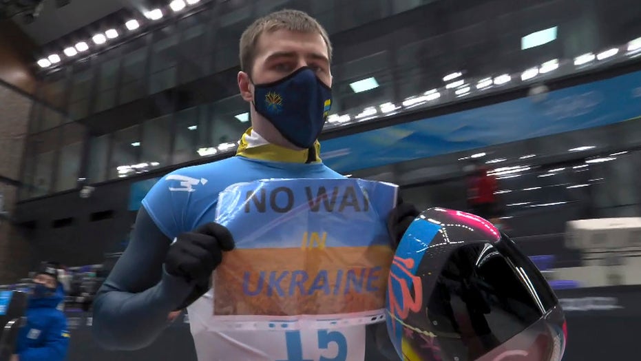 Olympian displays sign calling for ‘No War in Ukraine’