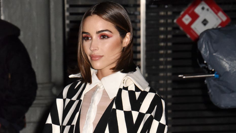Olivia Culpo covers up with winter gear during latest airport outing, pokes fun at American Airlines incident