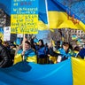 People participate in a pro-Ukrainian protest in Lafayette Park near the White House on February 27, 2022 in Washington, DC. Many U.S. cities have seen rallies in support of Ukraine over the weekend as the invasion by Russian forces continues.