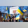 People participate in a pro-Ukrainian protest in Lafayette Park near the White House on February 27, 2022 in Washington, DC. Many U.S. cities have seen rallies in support of Ukraine over the weekend as the invasion by Russian forces continues.