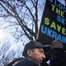 A demonstrator during a protest against the Russian invasion of Ukraine outside the White House in Washington, D.C., U.S., on Sunday, Feb. 27, 2022. Russia's plans for Ukraine face rapidly rising costs due to delays caused by tougher-than-expected resistance from forces on the ground, even as its military retains overwhelming advantages.