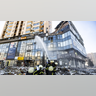 Firefighters work by a damaged apartment building in Kyiv which was hit by a recent shelling during Russia's invasion of Ukraine, on February 26, 2022