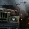 Ukrainian military track burns at an air defence base in the aftermath of an apparent Russian strike in Mariupol, Ukraine, Thursday, Feb. 24, 2022. Russian troops have launched their anticipated attack on Ukraine.