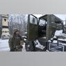 A Ukrainian servicemen opens the door of a deactivated Russian military multiple rocket launcher on the outskirts of Kharkiv, Ukraine, Friday, Feb. 25, 2022. Russian troops bore down on Ukraine's capital Friday, with gunfire and explosions resonating ever closer to the government quarter, in an invasion of a democratic country that has fueled fears of wider war in Europe and triggered worldwide efforts to make Russia stop.